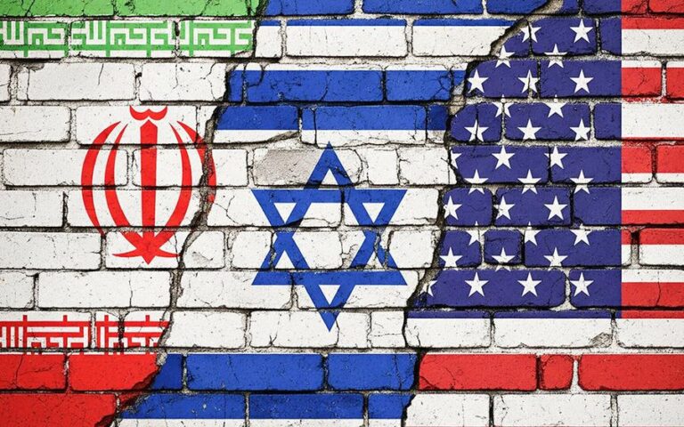 iran-estados-unidos-israel-banderas-pared-rota-3-18032026